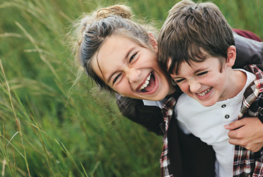 Brother and Sister Laughing